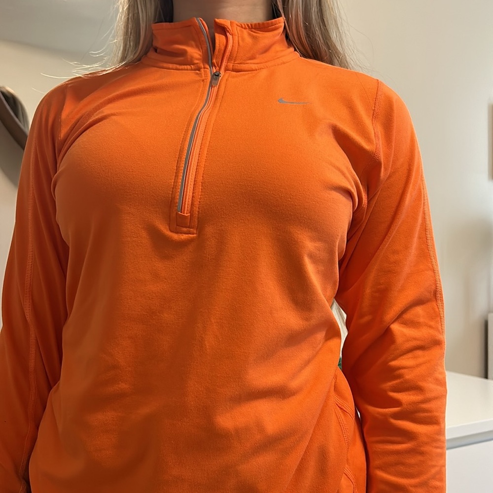 orange long sleeve athletics shirt